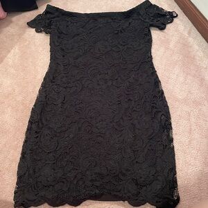 Ambiance black tight-fitting off-shoulder short sleeve mini dress. Size M.
